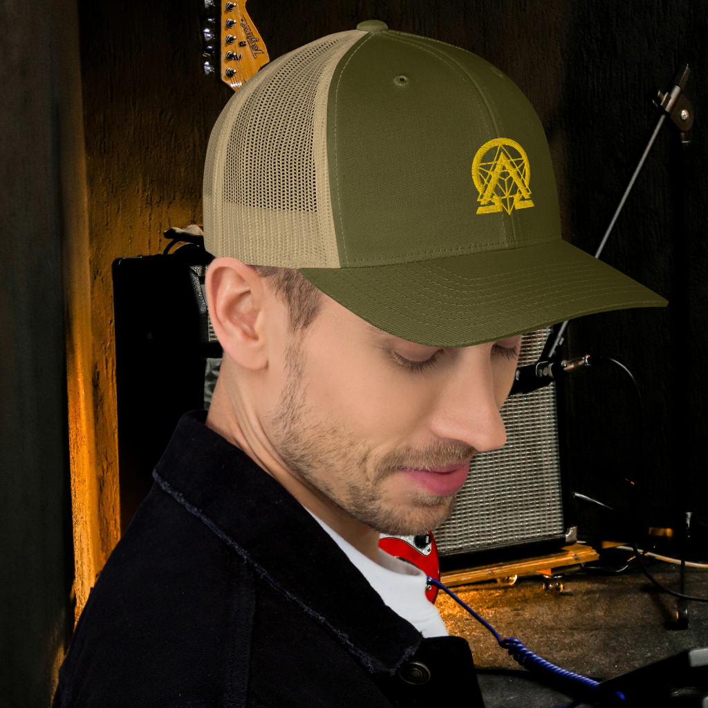 RNC Essential Artist's Trucker Cap olive angled lifestyle view.