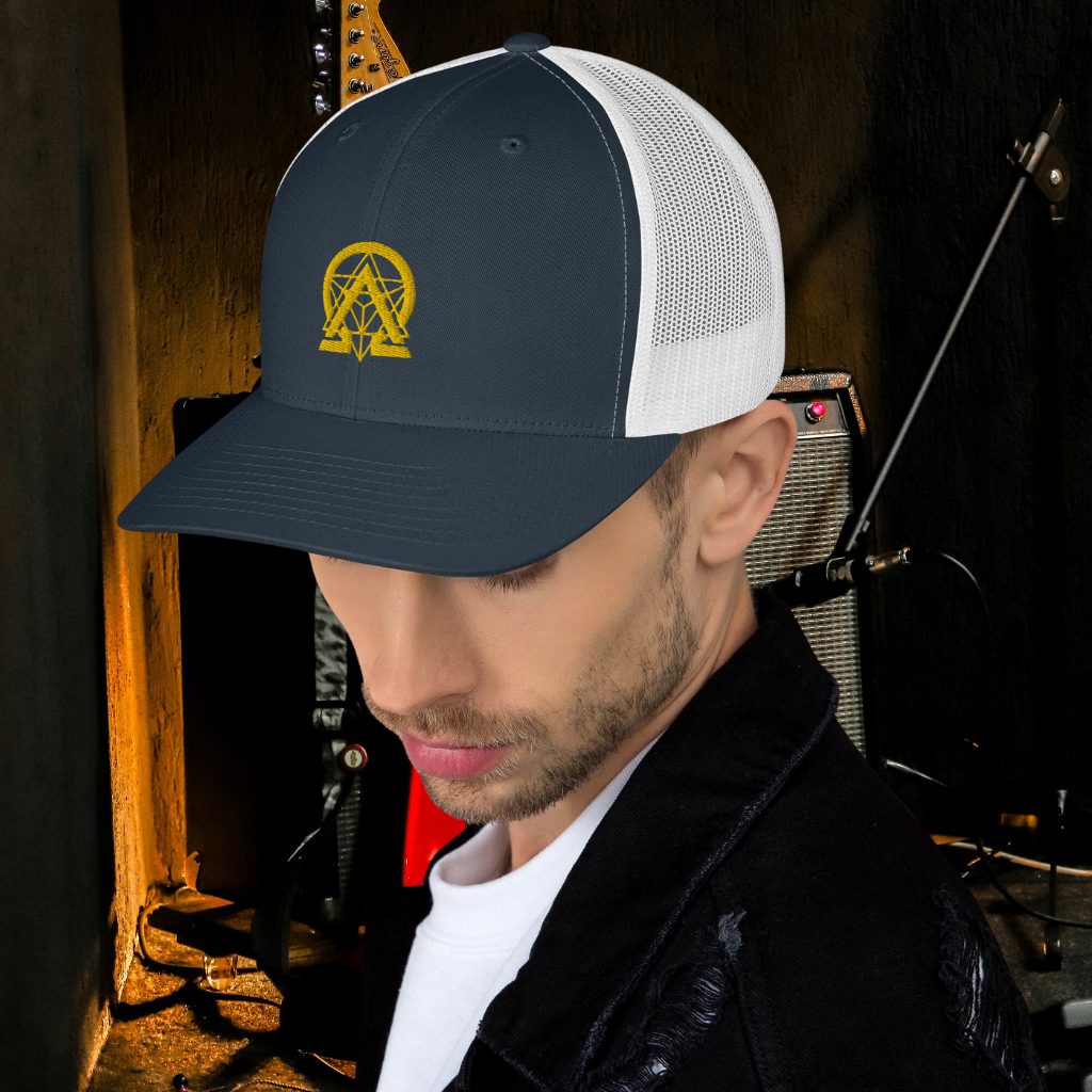 RNC Essential Artist's Trucker Cap navy close-up lifestyle view.