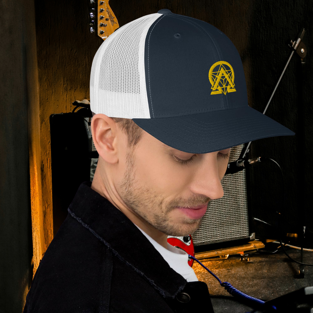 RNC Essential Artist's Trucker Cap navy angled lifestyle view.