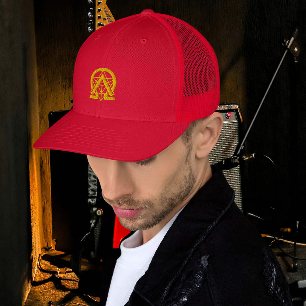 RNC Essential Artist's Trucker Cap red close-up lifestyle view.